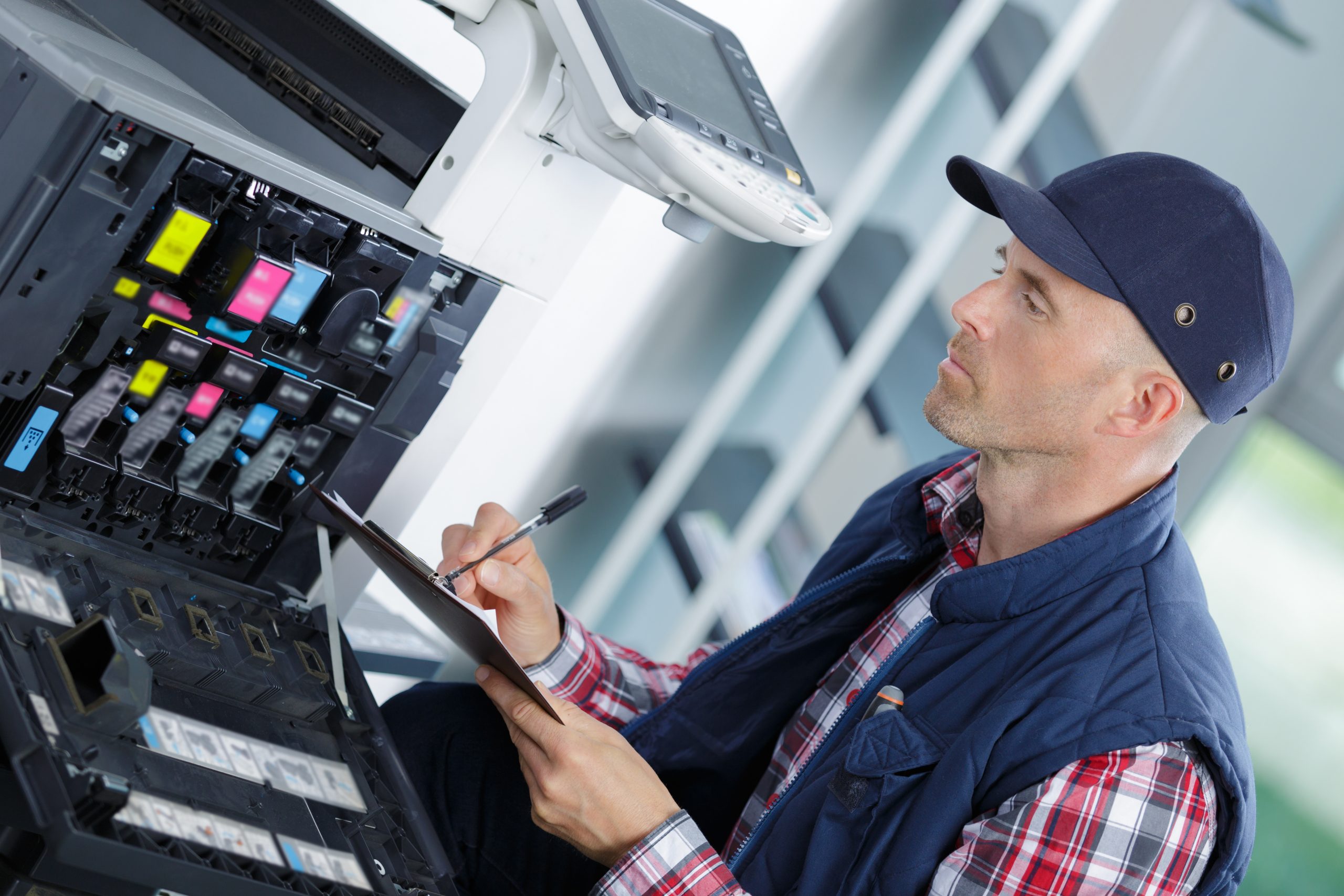 technician fix office photo copier