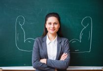 smiling teacher near the board