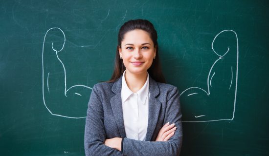 smiling teacher near the board