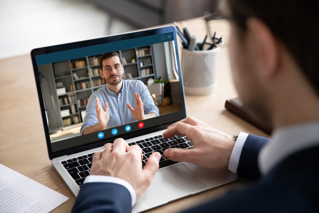 Two team members discussing business issues using a video call over a unified communications platform