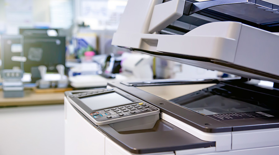 a macro shot of a printer to represent school office equipment