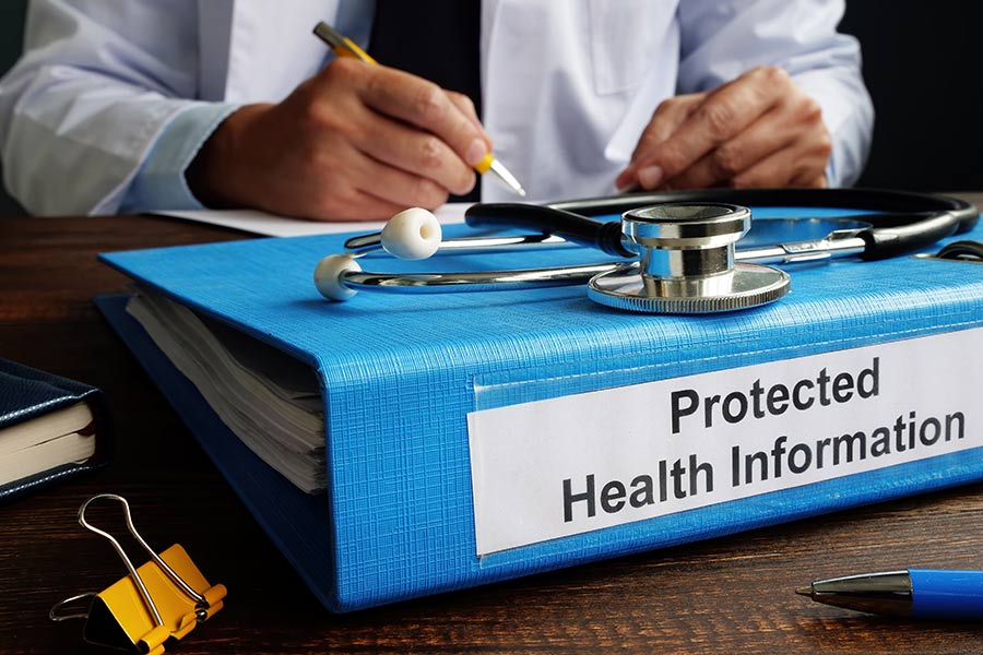 A file with HIPAA protected health information on a medical office's table