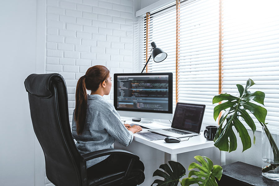 A woman in her remote work space