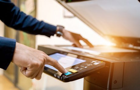 Man using a copier: hero image for Managed print solutions blog