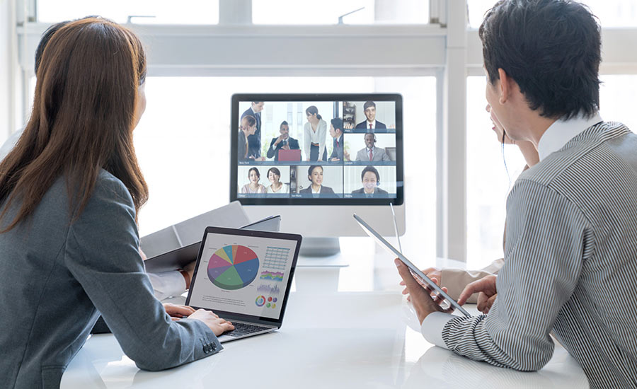 Two employees participating in a video conference