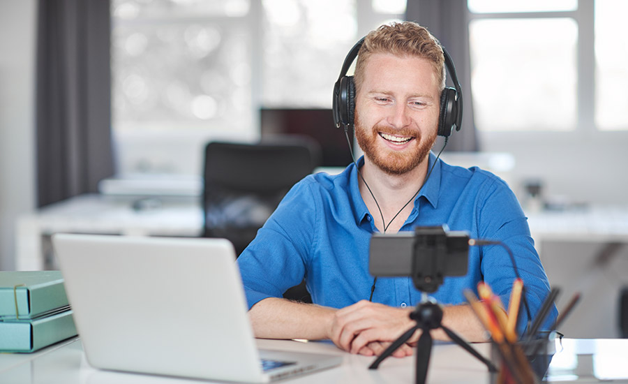 A man on a Zoom call with headphones