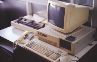 Old office and computer with obsolete technology
