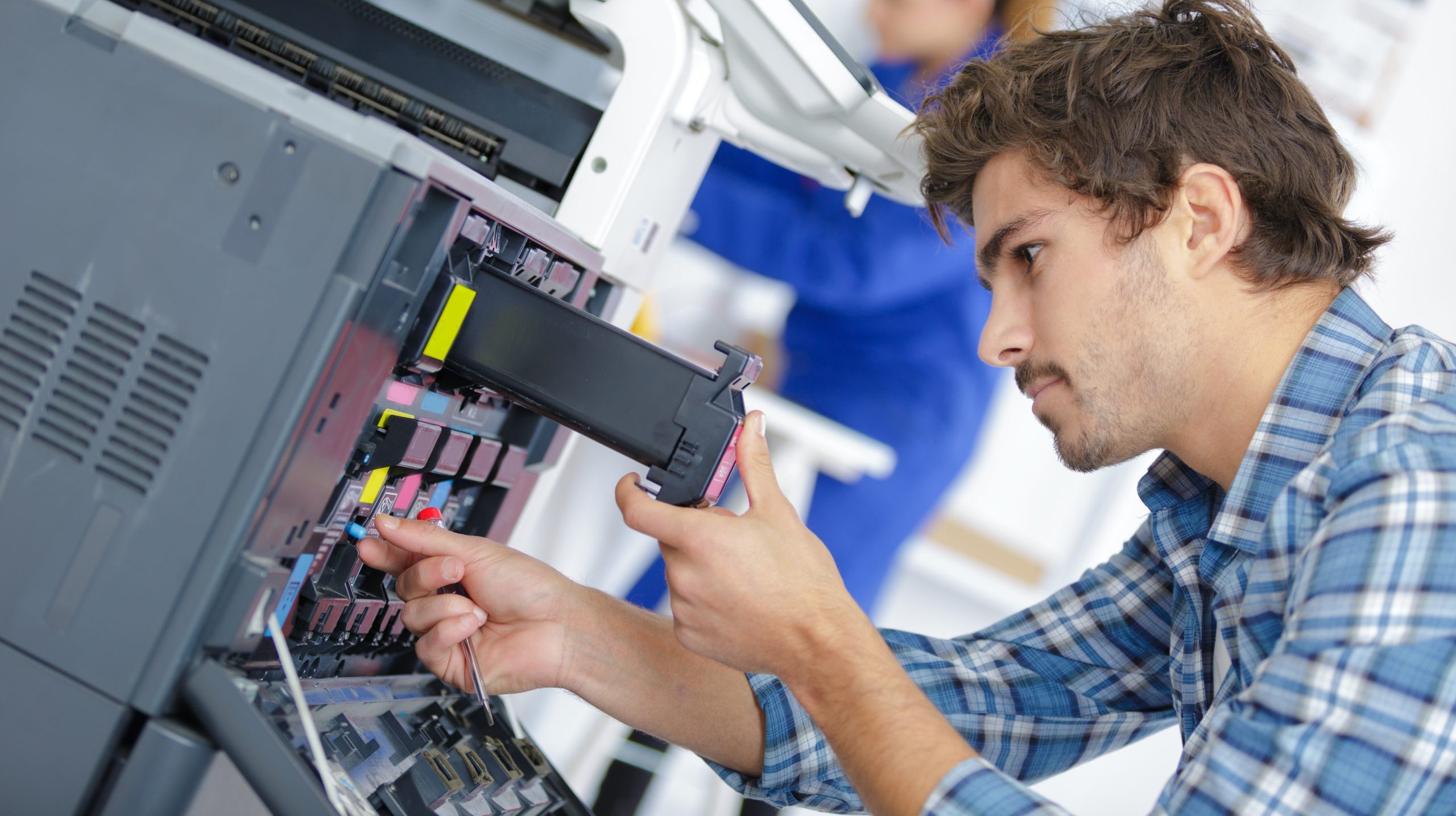 technician fixing printer