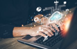 Technology / IT and cloud holographic above computer