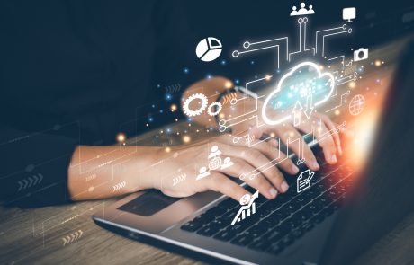 Technology / IT and cloud holographic above computer
