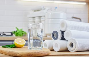 Reverse Osmosis filters and glass of clean water