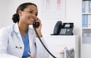 Doctor Using Modern Phone System